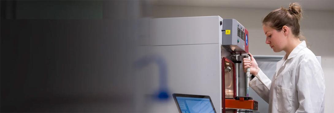 Female researcher working with a probe
