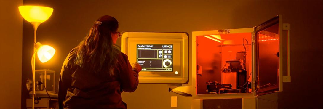 Woman working with CeraFab 7500 from Lithoz