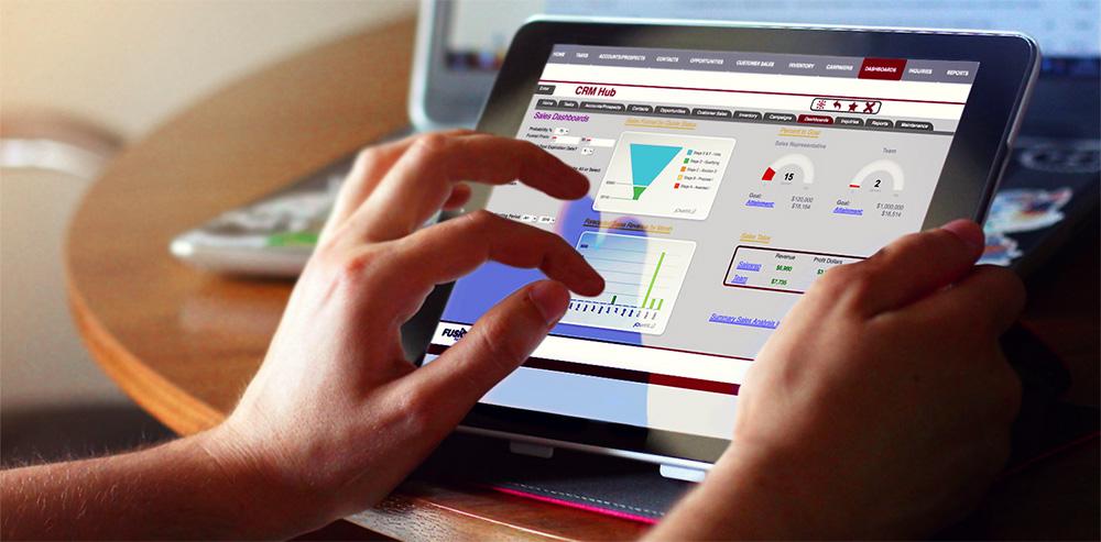 Two hands working on a tablet